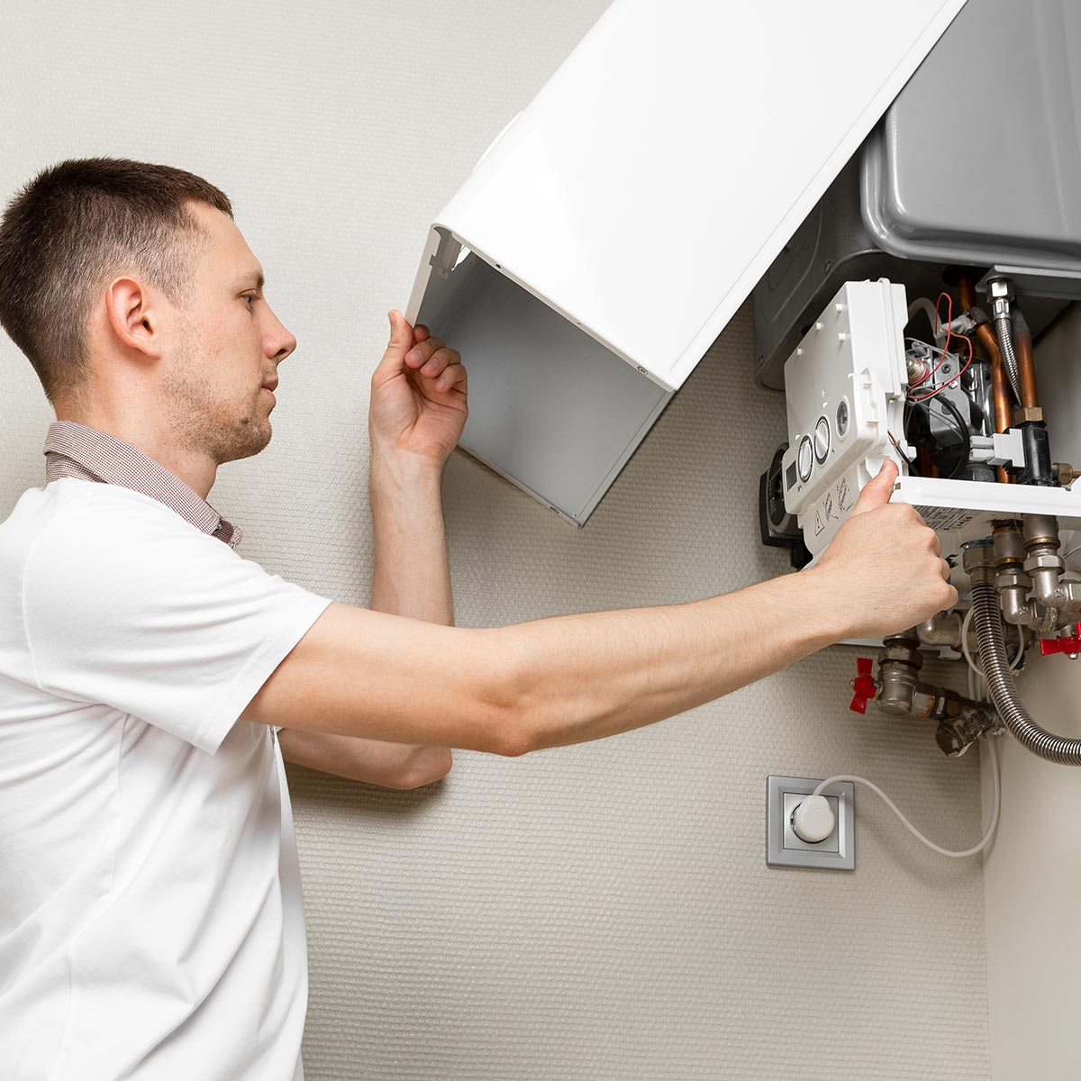 Plumber attaches Trying To Fix the Problem with the Residential